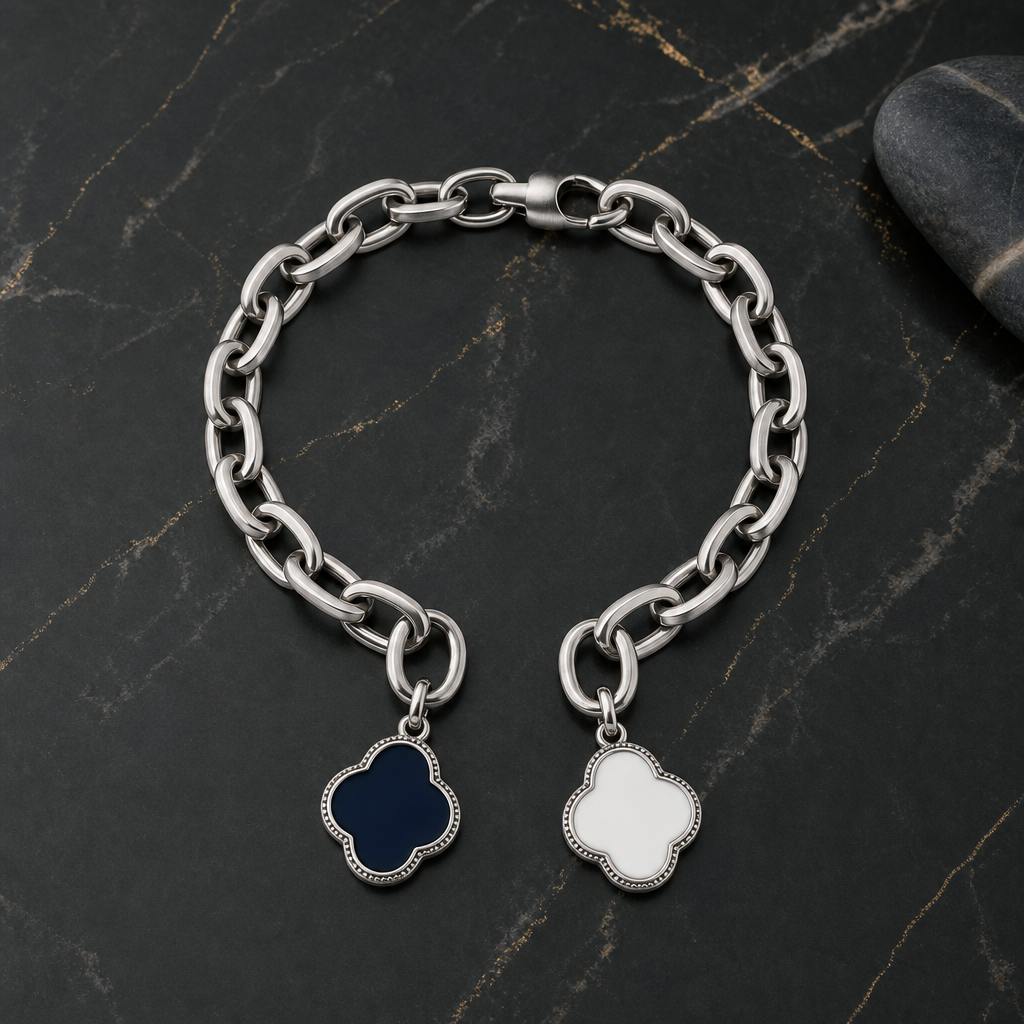 Clean studio shot of a 316L stainless steel enamel charm with visible jump ring and enamel detail on a white background