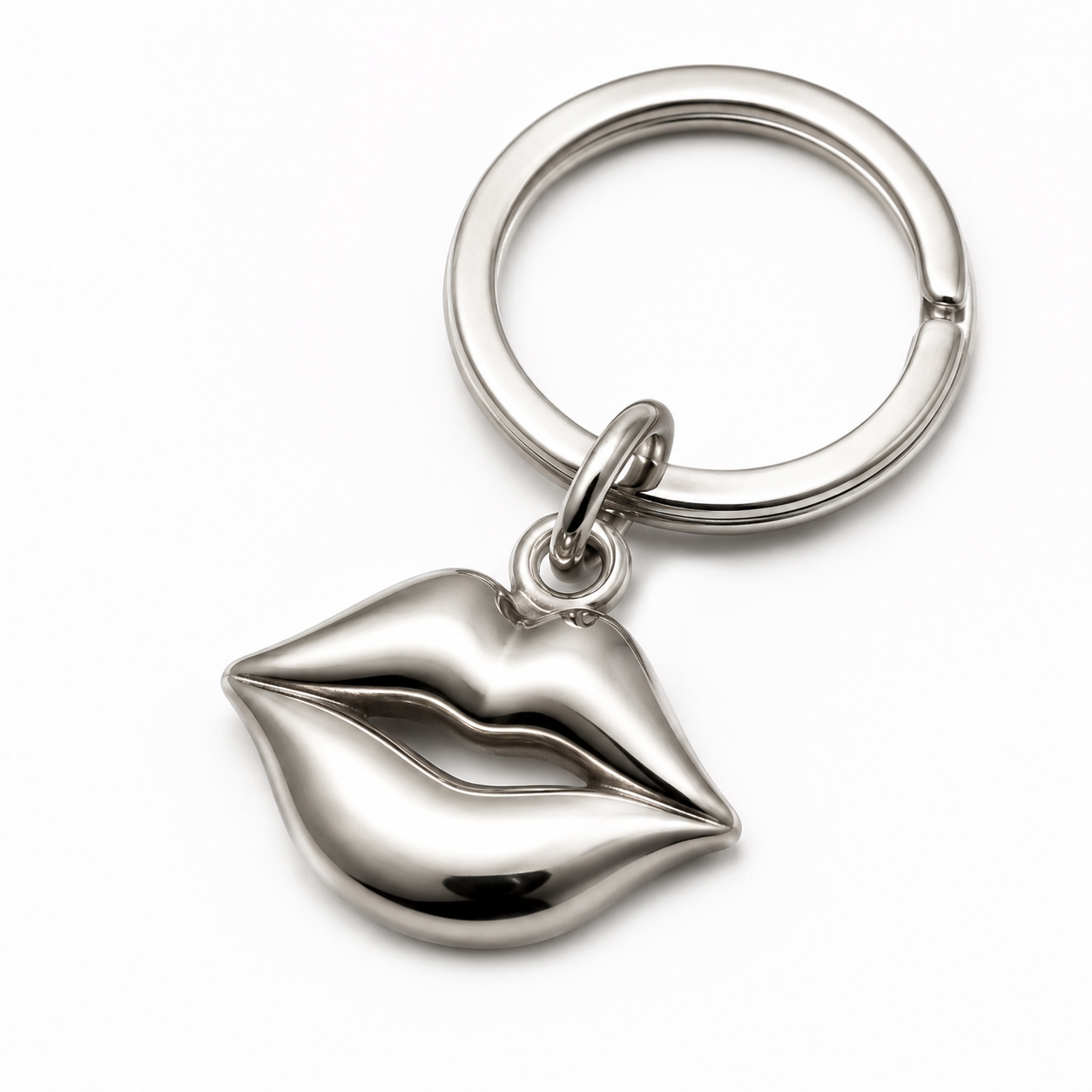 Premium finishing process of 316L stainless steel lip charm keychain on a clean studio backdrop