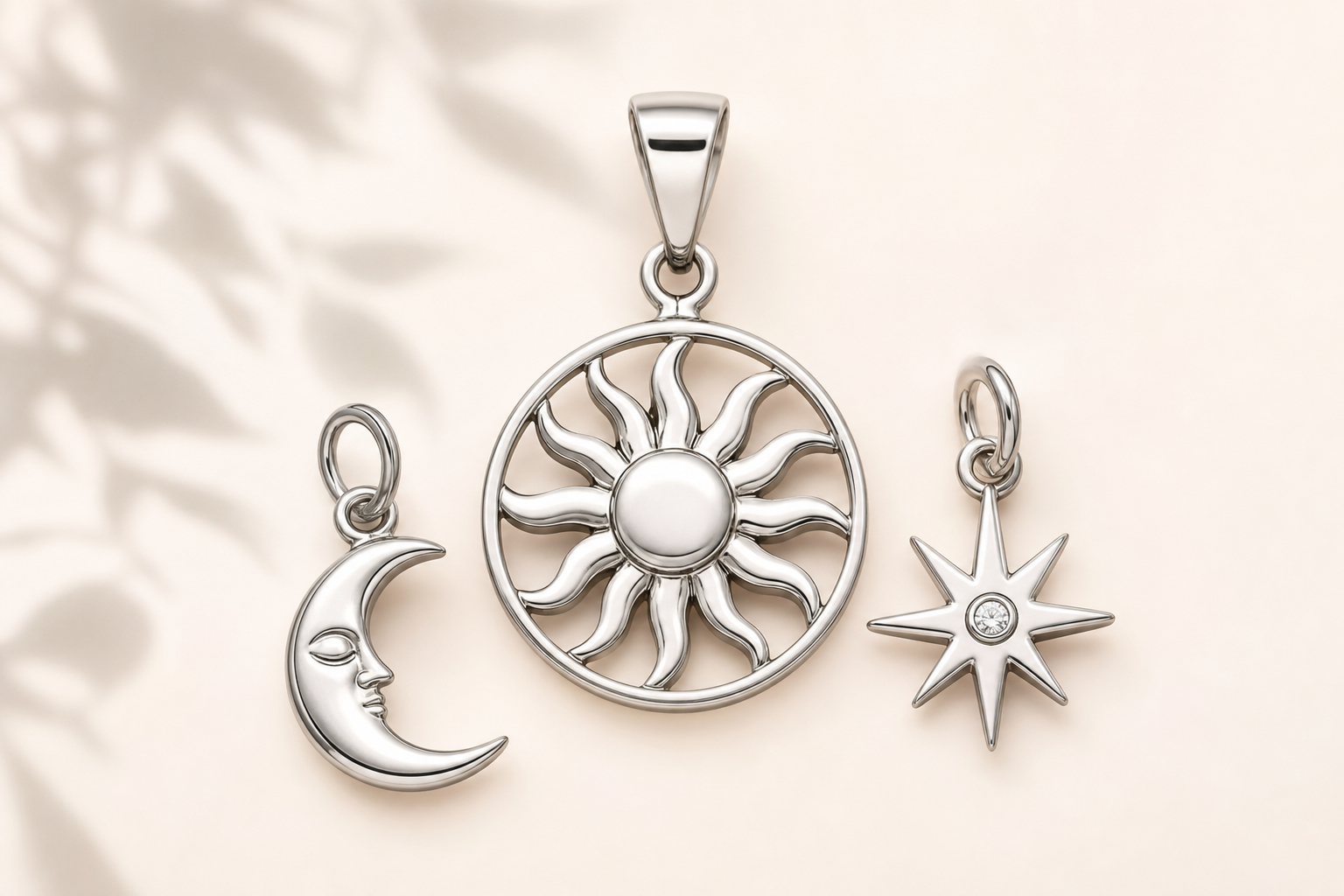 Close-up of a 316L stainless steel charm with PVD gold plating on a white background