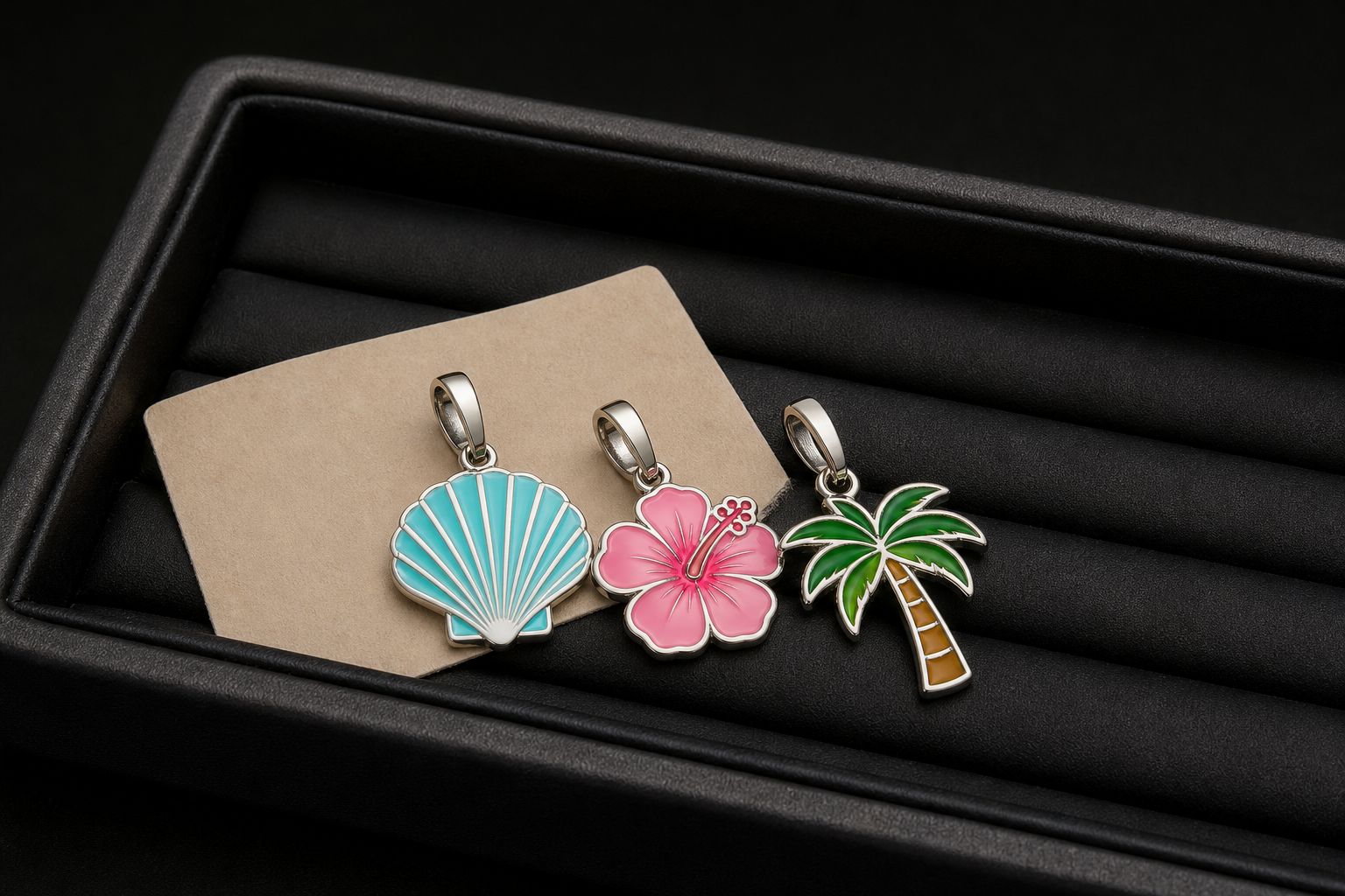 Close-up of a 316L stainless steel enamel charm with sleek PVD gold plating
