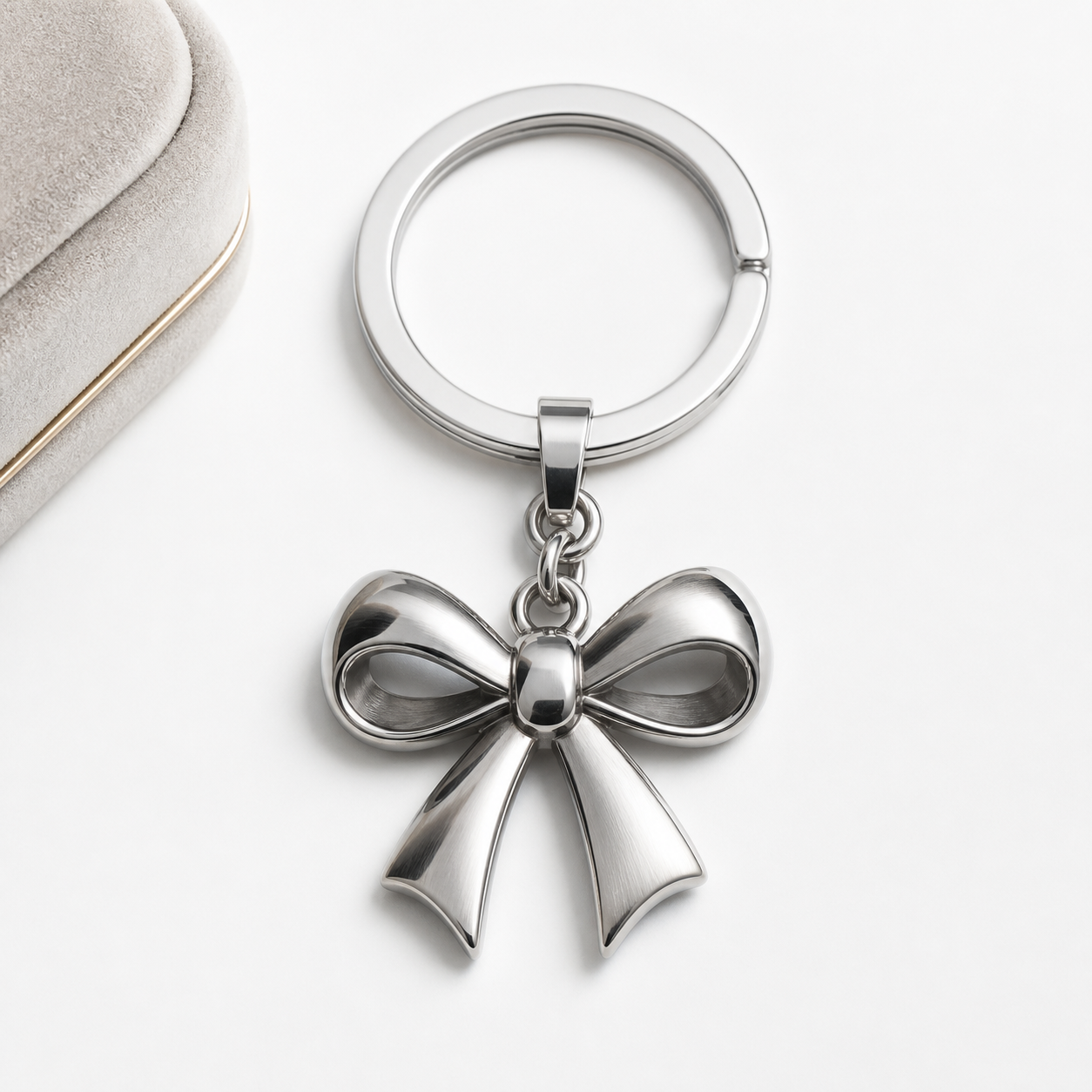 Close-up of a polished 316L stainless steel charm with a gold PVD finish on a white background