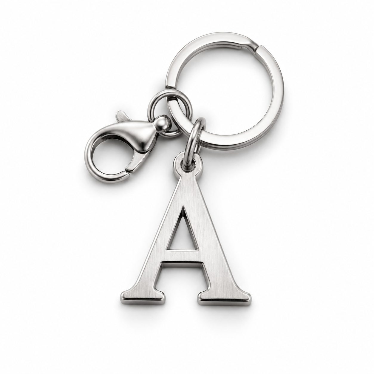 close-up of letter charm keychain on white background