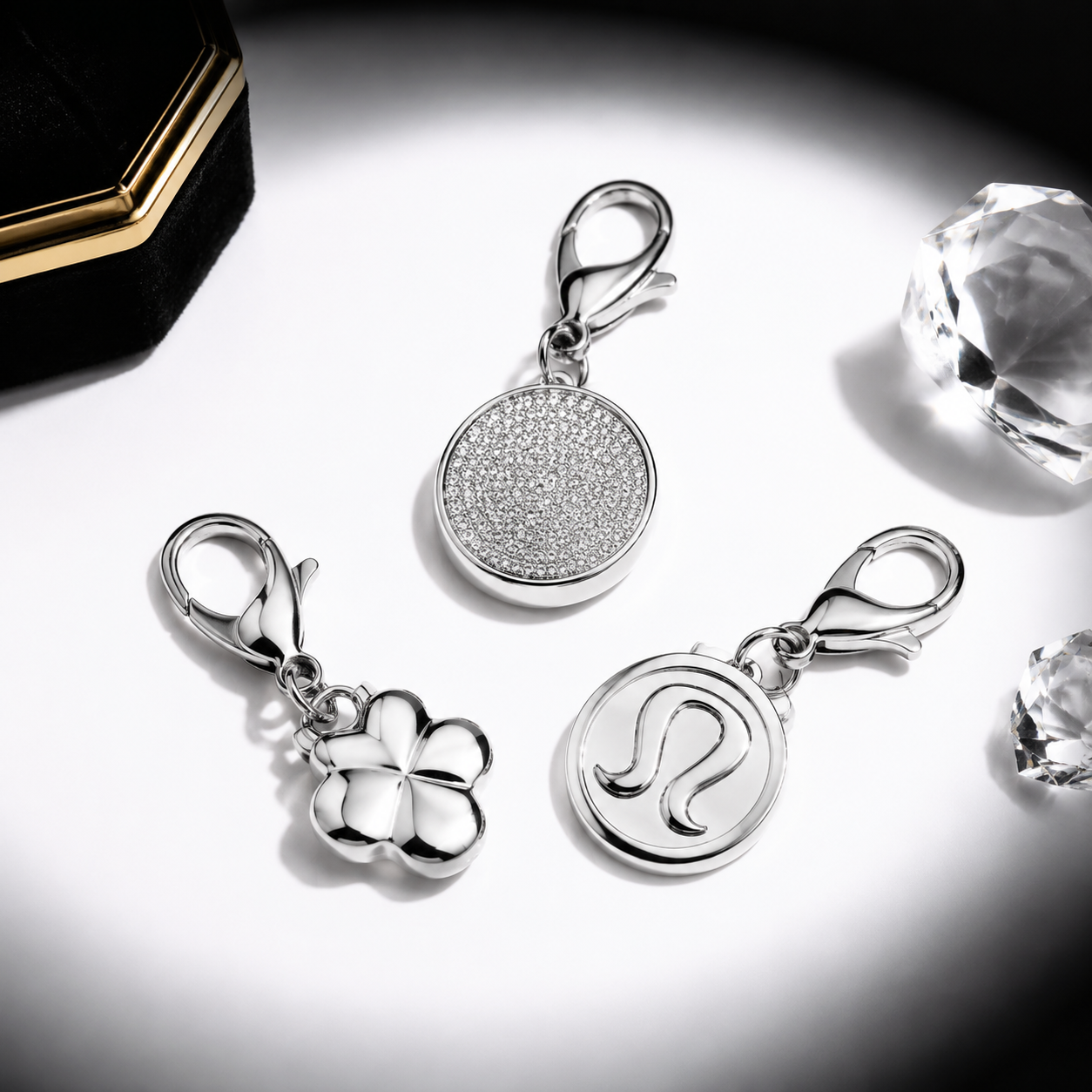 close-up of a 316L stainless steel belt bag charm with visible bail and polished finish on a neutral background