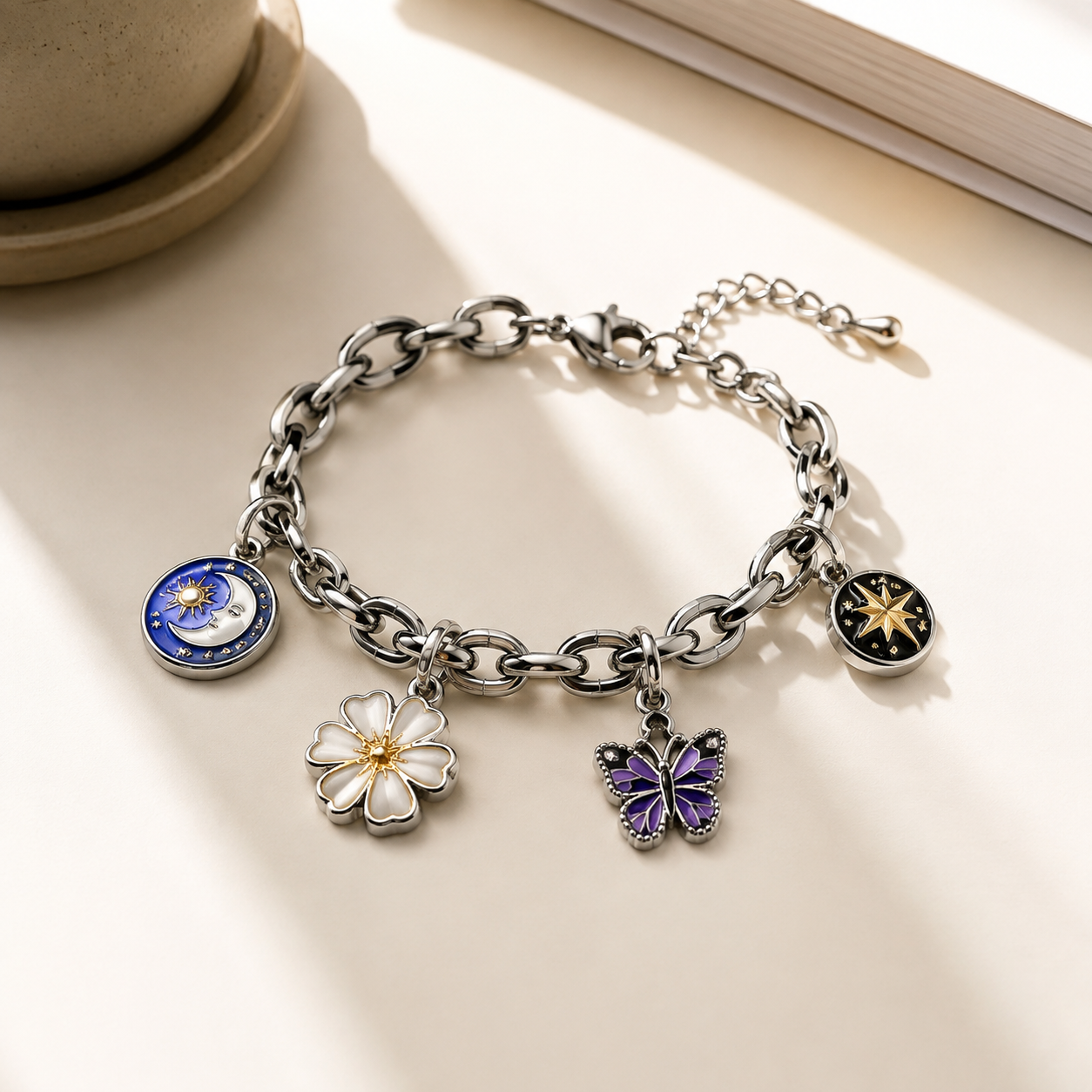 Close-up of a 316L stainless steel charm with enamel fill showing detailed front design and smooth edge finish