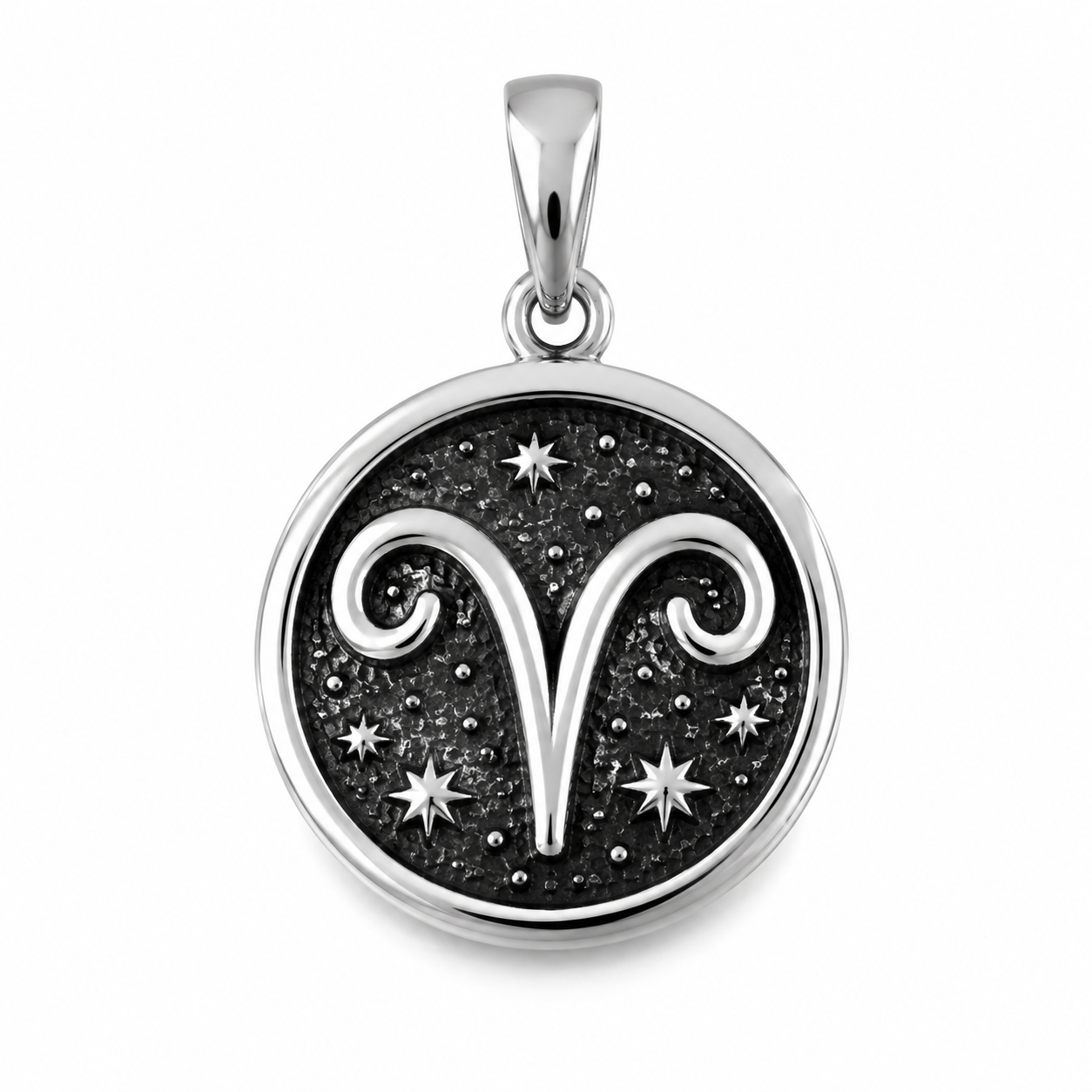 Close-up of a 316L stainless steel zodiac charm with enamel inlay on a neutral surface