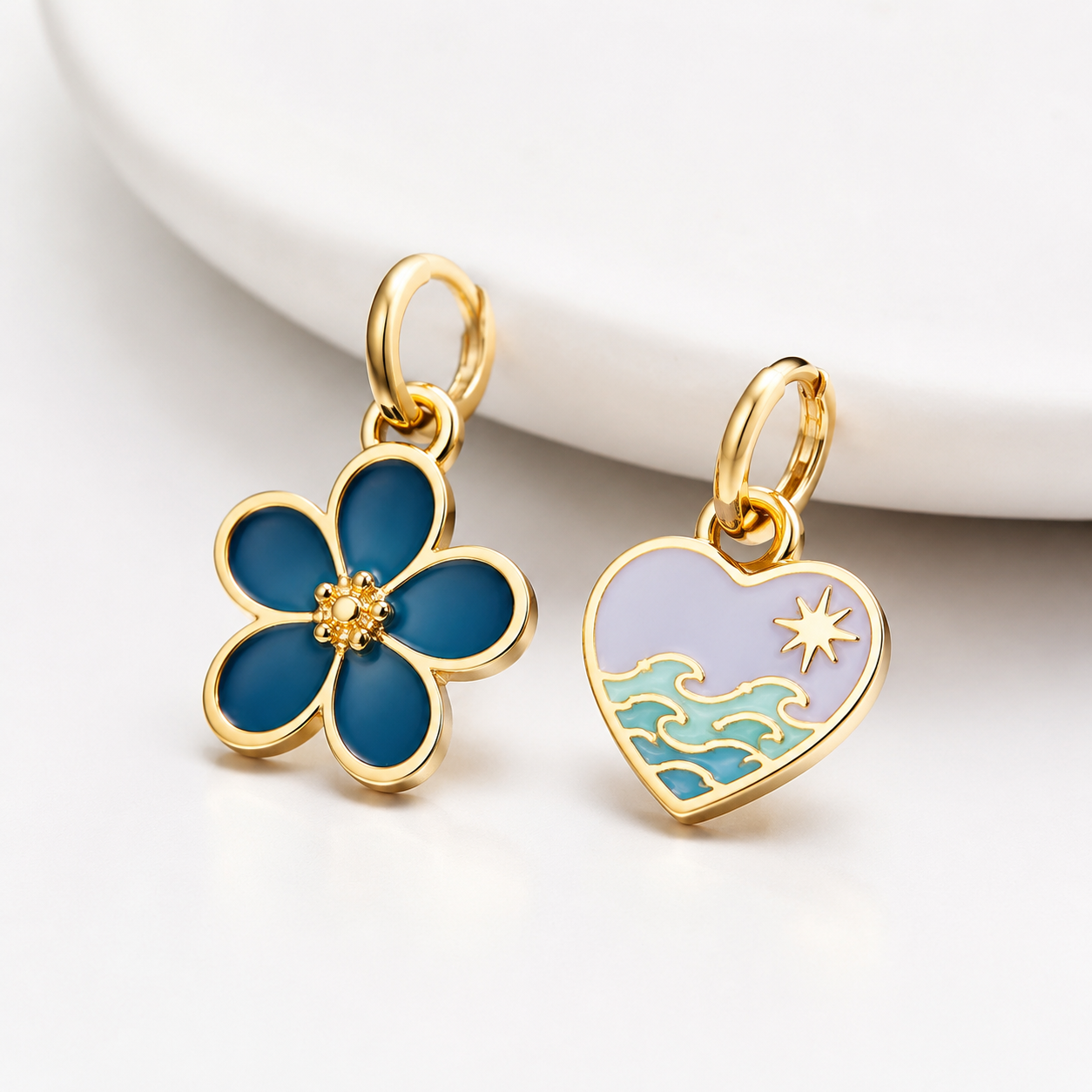 studio product photography of a single 316L stainless steel enamel charm with visible jump ring on white background