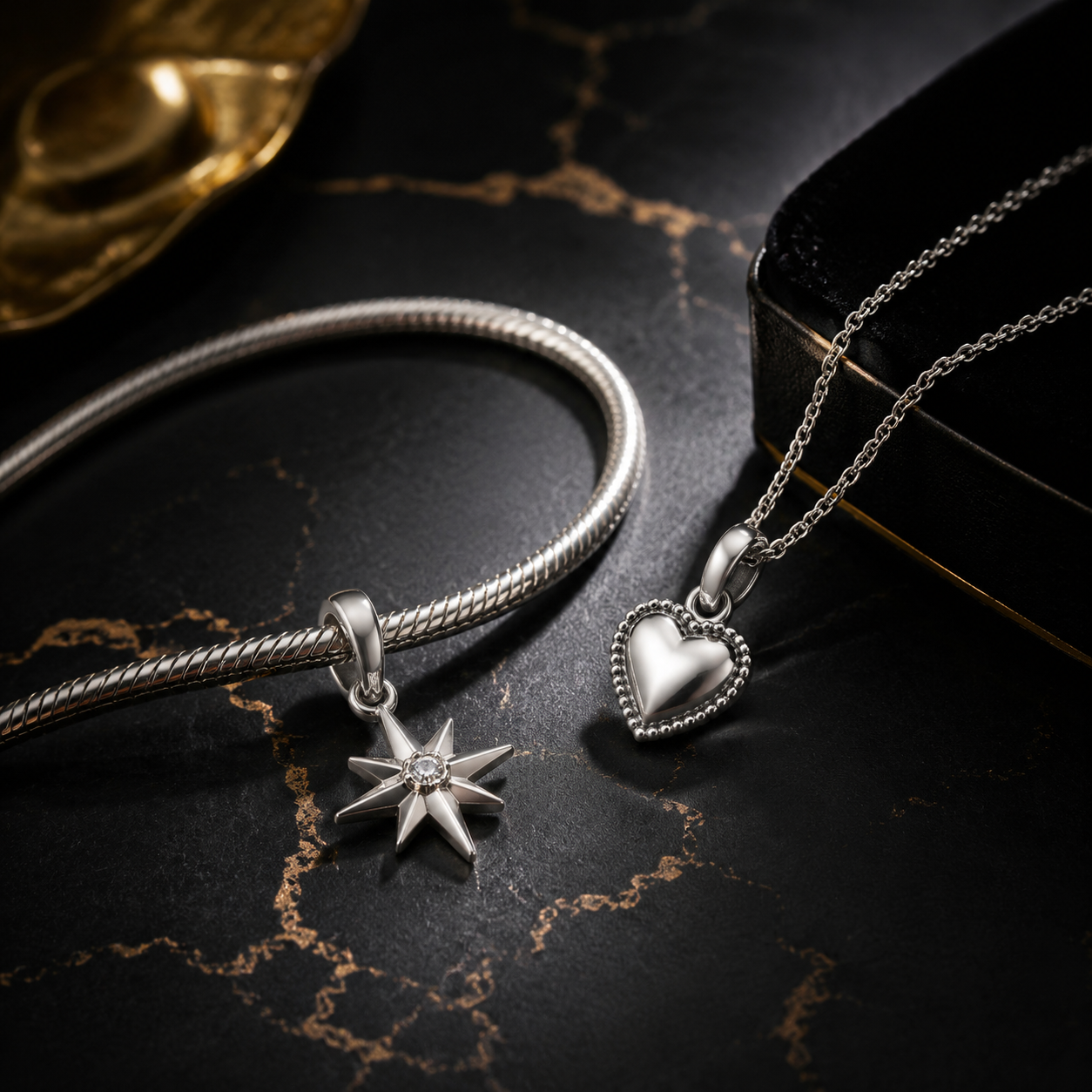 Studio product photography showing a single 316L stainless steel charm with visible jump ring, polished surface, and packaging card